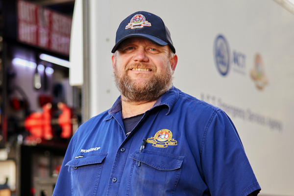 Photo of a male workshop staff wearing a cap