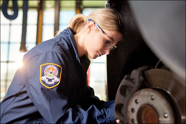 Workshop mechanic at work wearing safety glasses